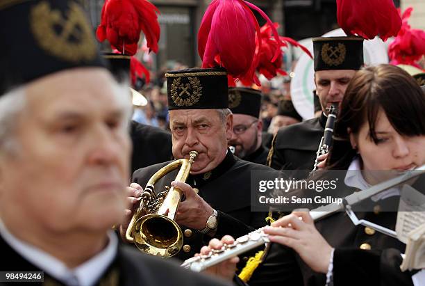 Polish miners' marching band plays somber tunes in memory of late Polish President Lech Kaczynski and his wife Maria outside the Presidential Palace...