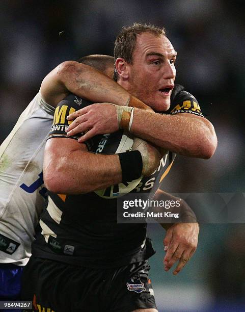 Gareth Ellis of the Tigers takes on the defence during the round six NRL match between the Wests Tigers and the Canterbury Bulldogs at the Sydney...