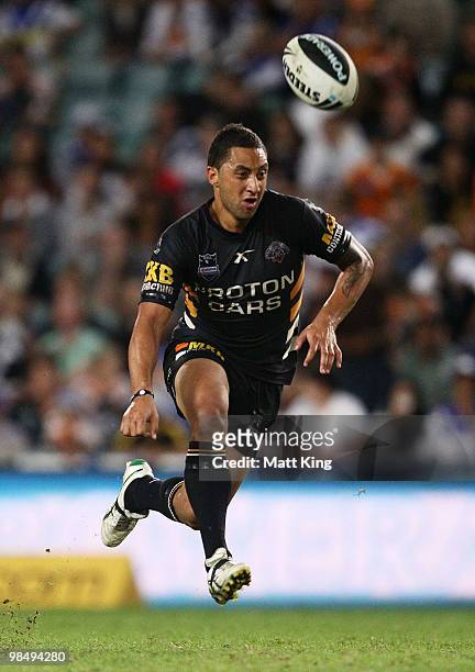 Benji Marshall of the Tigers chips ahead during the round six NRL match between the Wests Tigers and the Canterbury Bulldogs at the Sydney Football...