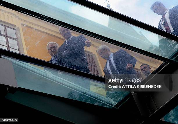 Presidents, Laszlo Solyom of Hungary and Ivo Josipovic of Croatia are pictured through a window as they arrived to the museum of the old-Christian...