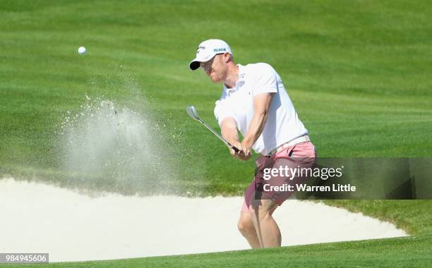 David Horsey of England plays out of the 18th greenside bunker ahead of the HNA Open de France at Le Golf National on June 27, 2018 in Paris, France.