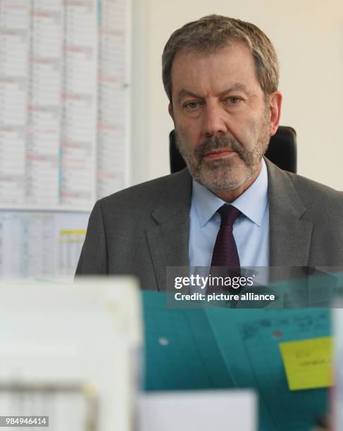 Peter Egetemaier, head of the Freiburg Criminal Investigation Department, reads a record of the investigation team 'Kamera' in Freiburg, Germany, 22...