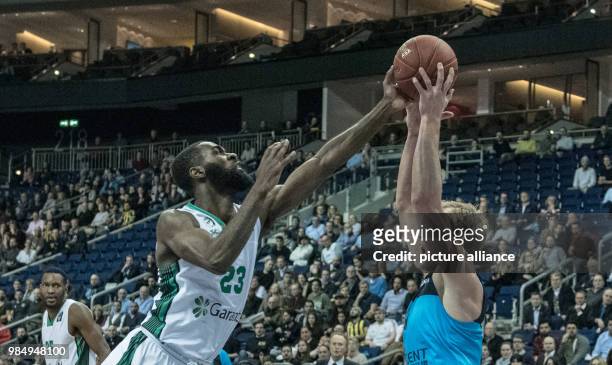 Berlin's Luke Sikma and Istanbul's Howard Sant-Roos vie for the ball during the Eurocup basketball match between ALBA Berlin and Darussafaka Istanbul...