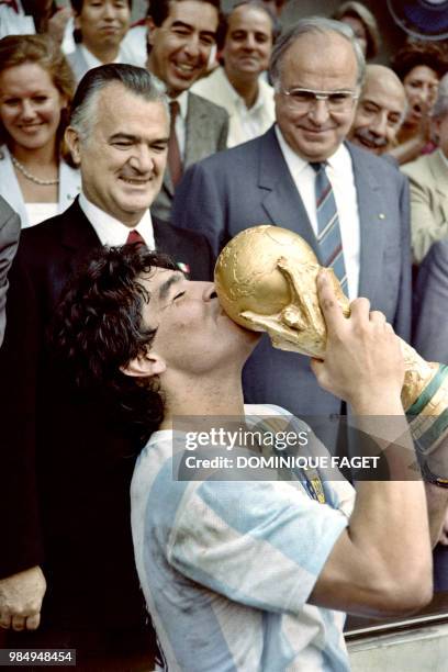 Argentina's soccer star team captain Diego Maradona kisses the World Soccer Cup won by his team after a 3-2 victory over West Germany on June 29,...