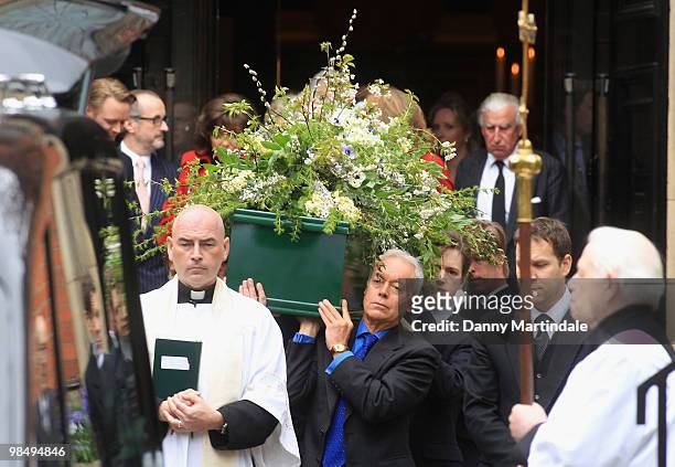 Nickolas Grace and the coffin bearers carry the coffin of Christopher Cazenove at his funeral held at St Paul's Church in Covent Garden on April 16,...