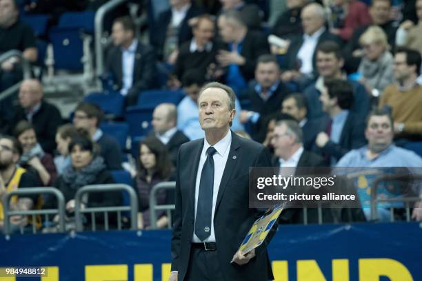 Berlin's coach Aito Garcia Reneses watches the match during the Eurocup basketball match between ALBA Berlin and Darussafaka Istanbul in the...