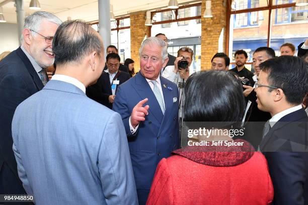 Prince Charles, Prince of Wales speaks to guests as he attends The Prince's Foundation School of Traditional Arts degree show in Shoreditch on June...