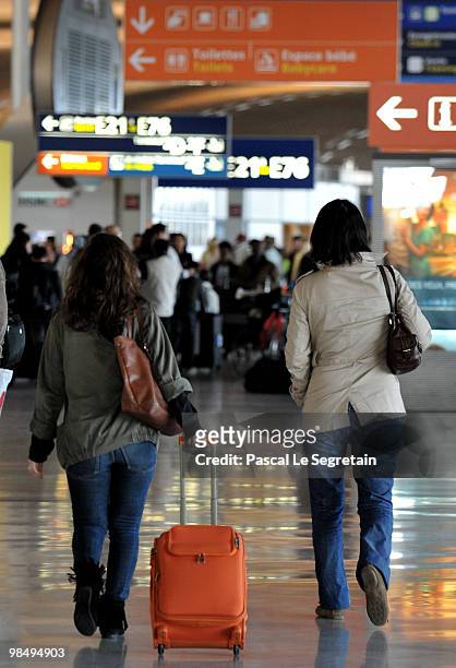 Passenger walk in a terminal at the Charles-de-Gaulle airport in Roissy on April 16, 2010 in Paris, France. Roissy Charles de Gaulle airport has been...