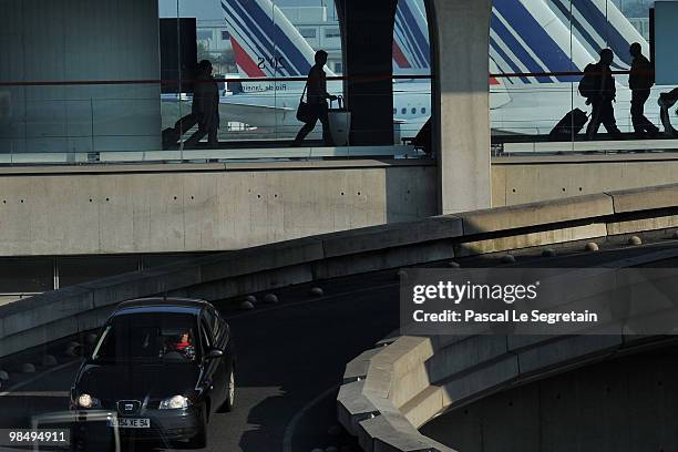 Passengers walk in a terminal at the Charles-de-Gaulle airport in Roissy on April 16, 2010 in Paris, France. Roissy Charles-de-Gaulle airport has...