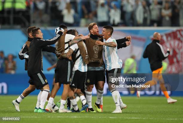 Marcos Rojo of Argentina celebrates at full time with team mates during the 2018 FIFA World Cup Russia group D match between Nigeria and Argentina at...