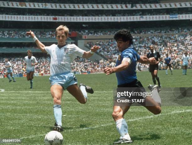 Argentinian forward Diego Maradona gets ready to cross the ball under pressure from English defender Gary Stevens during the World Cup quarterfinal...