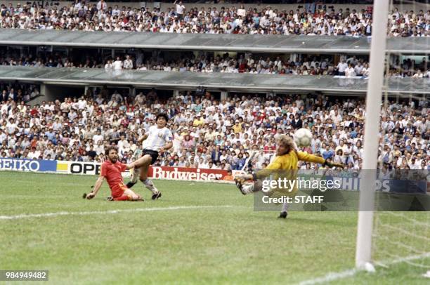 Argentinian forward Diego Maradona scores a goal, during the World Cup semi final soccer match between Argentina and Belgium on June 25, 1986 in...