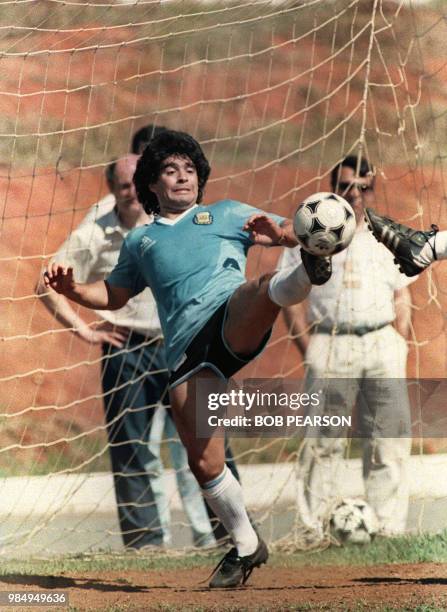 Argentine football legend and 1986 World Cup winning captain Diego Maradona trains 01 July 1989 in Goiania, the capital of the Brazilian state of...