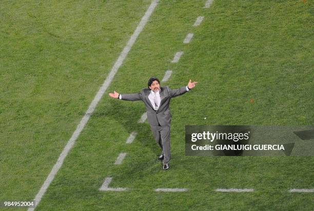 Argentina's coach Diego Maradona acknowledges the crowd during their 2010 World Cup group B first round football match against Nigeria at Ellis Park...