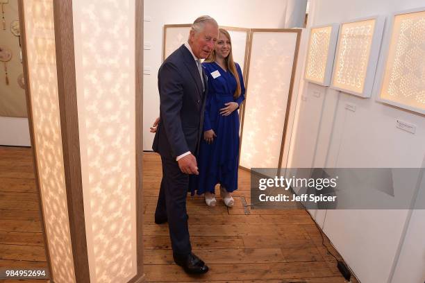 Prince Charles, Prince of Wales speaks to artist Jennifer Jackson as he attends The Prince's Foundation School of Traditional Arts degree show in...