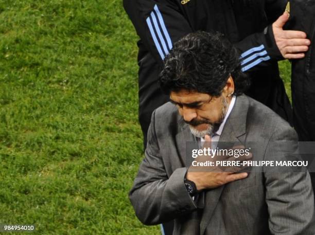 Argentina's coach Diego Maradona looks dejected as he leaves the pitch after his team lost the 2010 World Cup quarter-final football match Argentina...