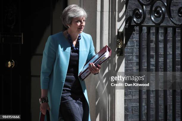 British Prime Minister Theresa May leaves Downing Street for the weekly Prime Ministers Questions in the House of Commons on June 27, 2018 in London,...