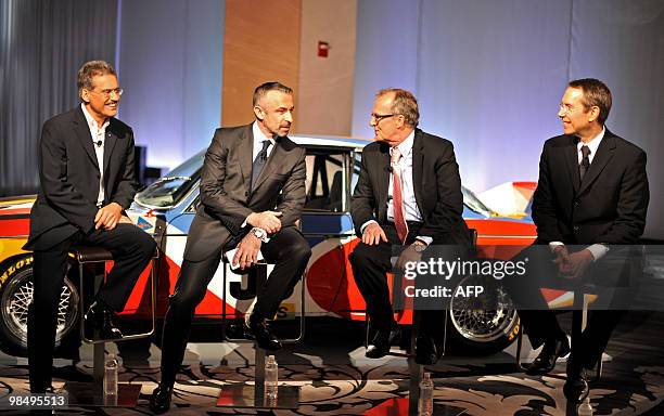 Artist Jeff Koons presents his preliminary design for BMW's 17th Art Car in New York on April 6, 2010 joined by, from left to right, BMW Motorsport...