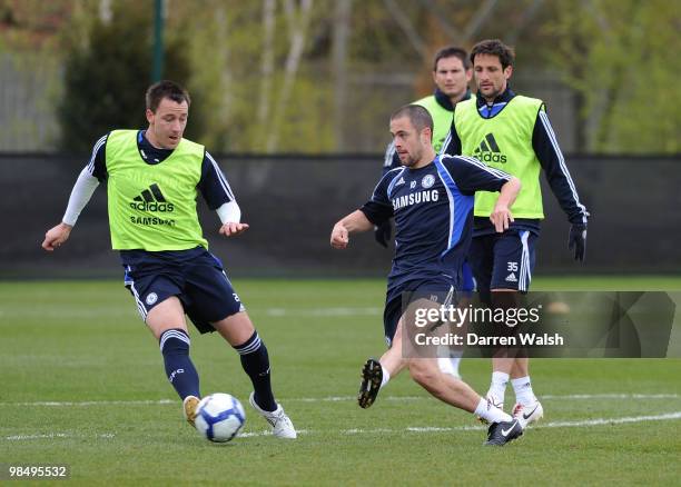 Joe Cole and John Terry of Chelsea during a training session at the Cobham Training Ground on April 16, 2010 in Cobham, England.