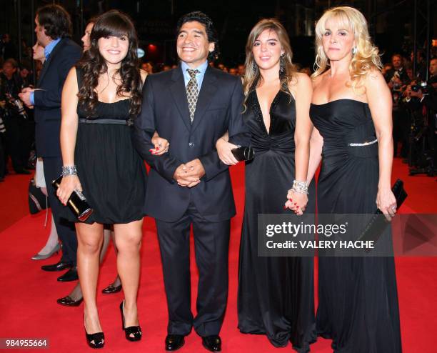 Former Argentinian football player Diego Maradona poses with his wife Claudia and daughters Giannina and Dalma as he arrives to attend the screening...