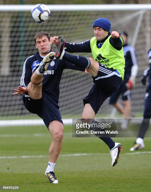Branislav Ivanovic and Yury Zhirkov of Chelsea during a training session at the Cobham Training Ground on April 16, 2010 in Cobham, England.