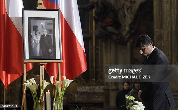 Czech Prime Minister Jan Fischer pays respects to Poland's late President Lech Kaczynski and his wife Maria during the memorial mass to at the St....