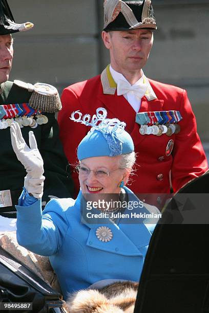 Queen Margrethe of Denmark waves to wellwishers from a carriage during celebrations marking her 70th birthday on April 16, 2010 in Copenhagen. Queen...