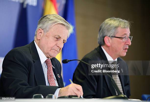 Jean-Claude Trichet, president of the European Central Bank , left, listens as Jean-Claude Juncker, Luxembourg's prime minister and president of the...