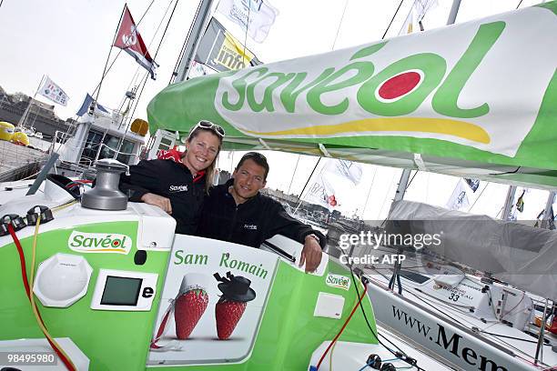 British offshore sailor Samantha Davies and her companion French yachtman Romain Attanasio pose on their monohull "Saveol", on April 16, 2010 in...