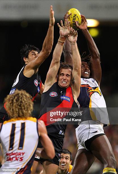 Patrick Ryder and Andrew Welsh of the Bombers contest a mark against Nic Naitanui of the Eagles during the round four AFL match between the West...