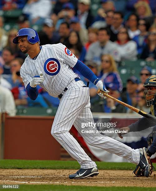 Aramis Ramirez of the Chicago Cubs runs after hitting the ball against the Milwaukee Brewers on Opening Day at Wrigley Field on April 12, 2010 in...