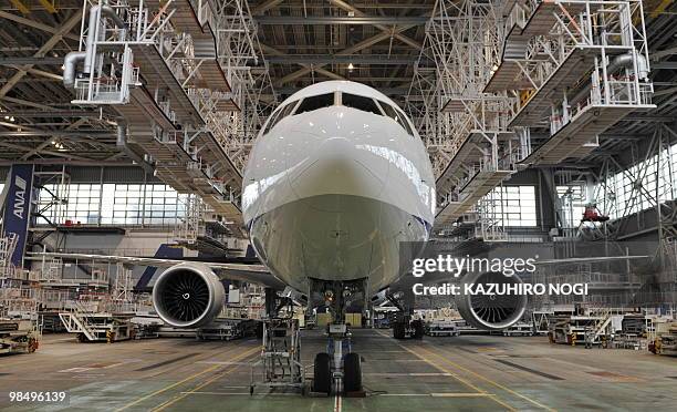 Japan's All Nippon Airways displays its new passenger plane Boeing 777-300ER during a press preview at an ANA hungar in Narita International Airport,...