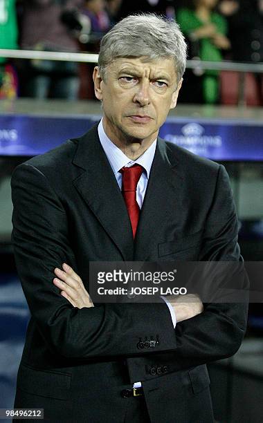Arsenal's French coach Arsene Wenger looks on during their UEFA Champions League quarter-final second leg football match against FC Barcelona at the...
