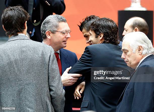 Alberto Ruiz Gallardon, mayor of Madrid jokes with Raul Gonzales of Real Madrid during the UEFA Champions League trophy handover ceremony at Palacio...