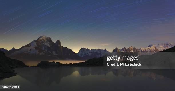 star trails seen from lac blanc, french alps in france. - schick stock pictures, royalty-free photos & images