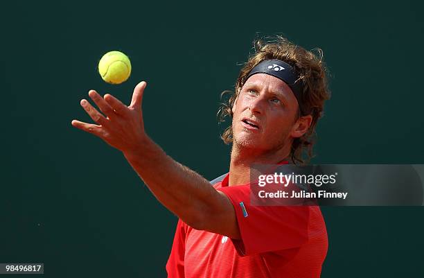 David Nalbandian of Argentina serves to Novak Djokovic of Serbia during day five of the ATP Masters Series at the Monte Carlo Country Club on April...