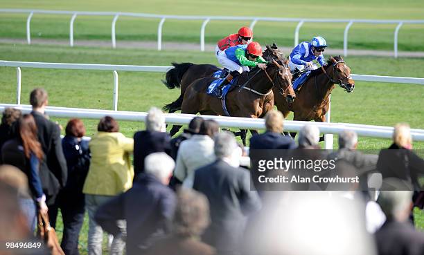 Funky Lady and Richard Hughes challenge late to win The Bridget maiden Fillies' Stakes at Newbury racecourse on April 16, 2010 in Newbury, England