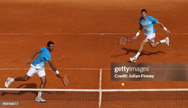 Mahesh Bhupathi of India and Max Mirnyi of Belarus in action in their doubles match against Bob Bryan and Mike Bryan of USAduring day five of the ATP...