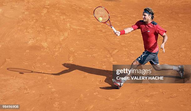 Argentinian David Nalbandian hits a return to Serbian Novak Djokovic during their ATP Monte Carlo Masters 1000 quarter-final on April 16, 2010 in...