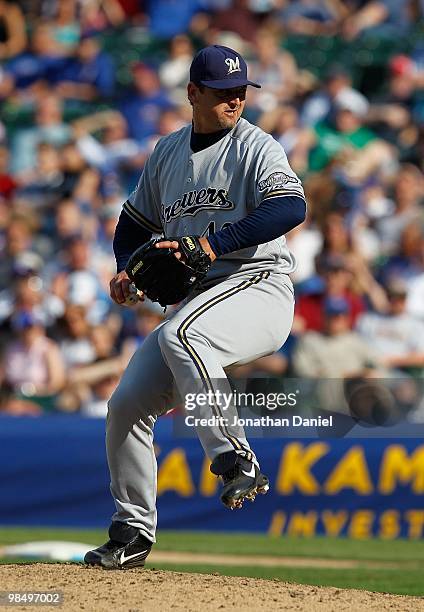 Trevor Hoffman of the Milwaukee Brewers, wearing a number 42 jersey in honor of Jackie Robinson, delivers the ball as he finishes off the Chicago...