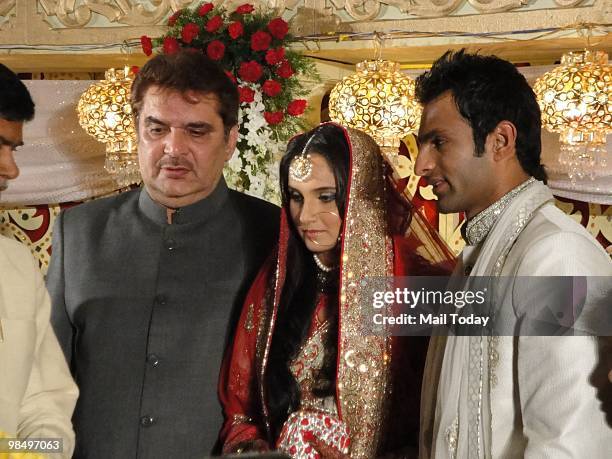 Sania Mirza with husband Shoaib Malik at her wedding reception in Hyderabad on April 15, 2010.