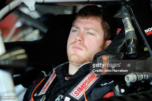 Robert Richardson Jr., driver of the R3 Motorsports Chevrolet, sits in his care in the garage during practice for the NASCAR Nationwide Series...
