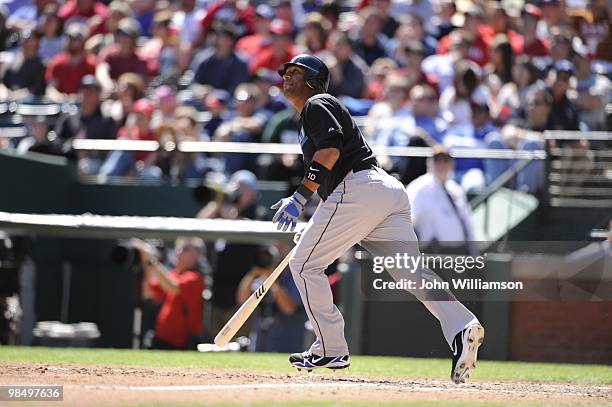 Vernon Wells of the Toronto Blue Jays hits a home run and watches the ball as he runs to first base from the batter's box during the game against the...