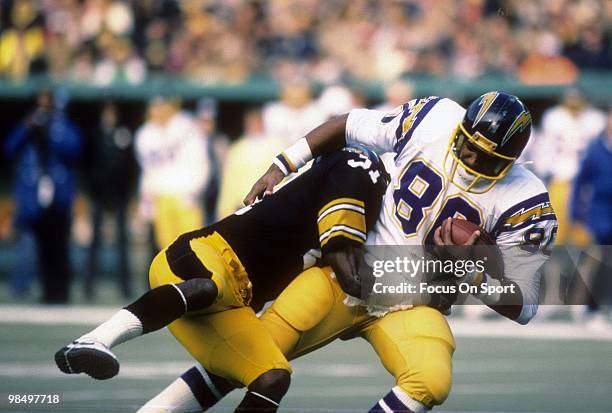 S: Tight End Kellen Winslow of the San Diego Chargers is tackled by defensive back Donnie Shell of the Pittsburgh Steelers circa early 1980's during...
