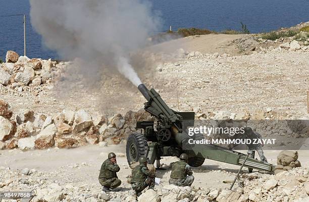 Lebanese troops fire a 155mm Howitzer gun as they take part in joint military drill with the United Nations Interim Forces in Lebanon in Naqura on...