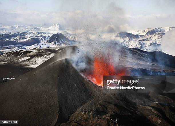 An aerial view of a volcanic eruption between the Myrdalsjokull and Eyjafjallajokull glaciers on March 24, 2010 in Fimmvorduhals, Iceland. A major...