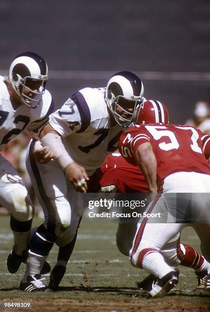 S: Defensive Tackle Merlin Olsen of the Los Angeles Rams is blocked by guard Jeff Van Note of the Atlanta Falcons circa early 1970's during an NFL...