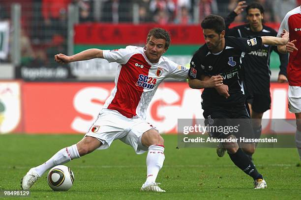 Daniel Baier of Augsburg battles for the ball with Oilivier Veigneau of Duisburg during the Second Bundesliga match between FC Augsburg and MSV...