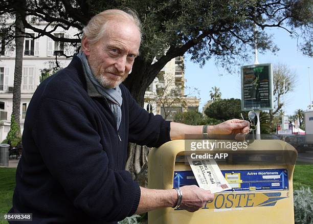 British actor Charles Dance poses, posting a letter promoting "Going Postal" a television adaptation of the book of the same name by Terry Pratchett,...