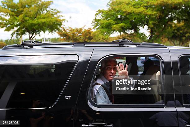 Florida Governor Charlie Crist waves as he leaves a dedication ceremony at the Alonzo & Tracey Mourning Senior High School on April 16, 2010 in North...